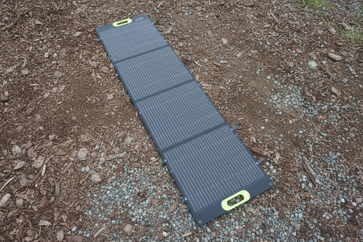 Black solar panel on gravel. 200W Folding MC4