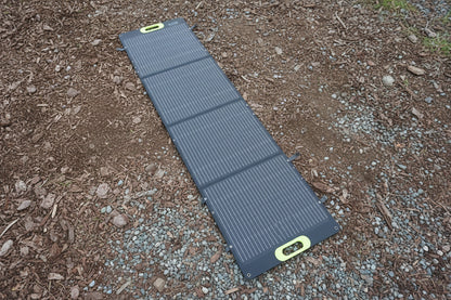 Black solar panel on gravel. 200W Folding MC4