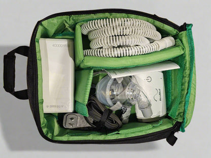 Green carrying case bag with Travel CPAP equipment including a mask and tubing and travel battery RESMED BMC 